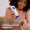 Nivea Q10 3 in 1 Handáburður sem vinnur gegn öldrunareinkennum húðarinnar 100 ml