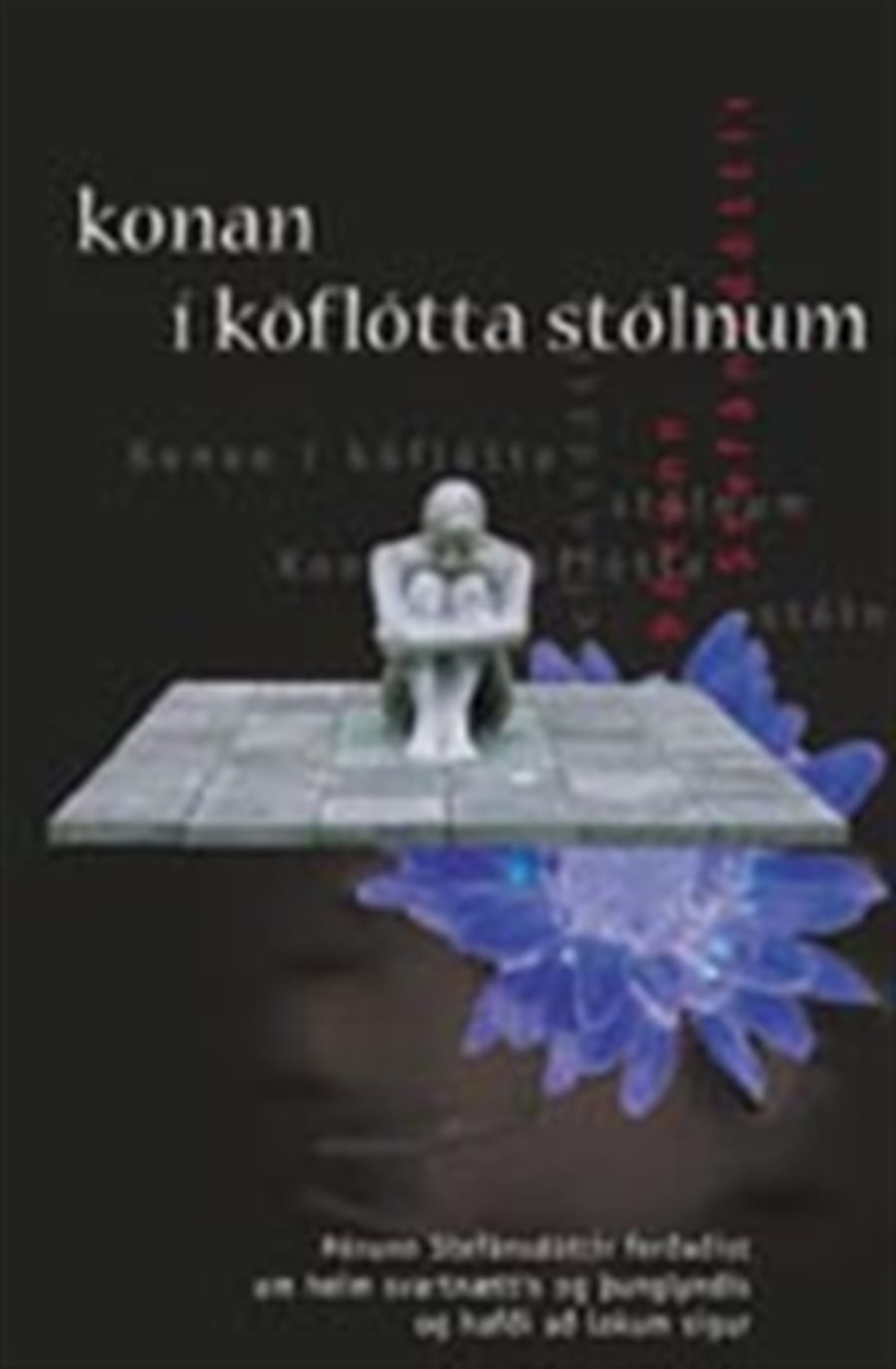 Konan í köflótta stólnum